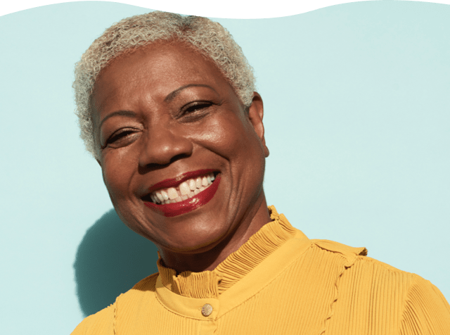 Woman with big smile and yellow blouse